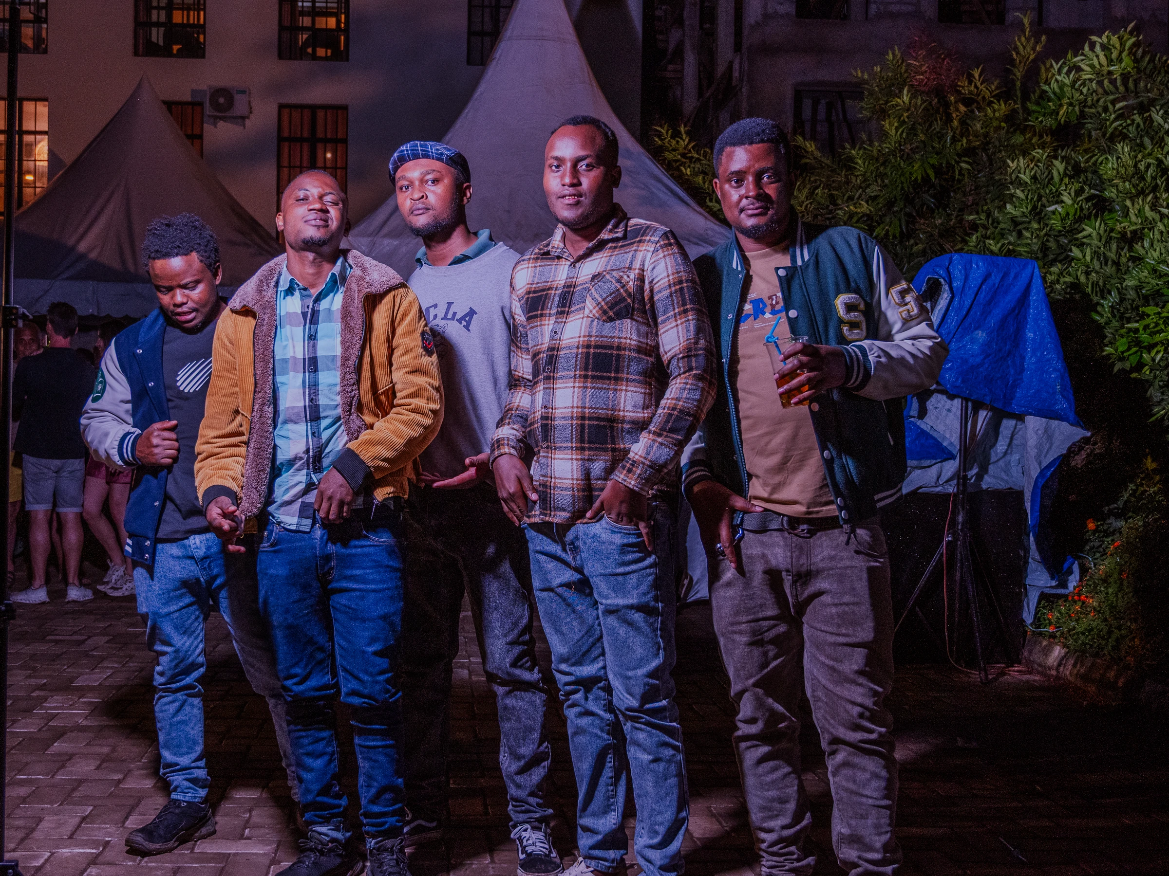 Group of guests posing together at an evening celebration